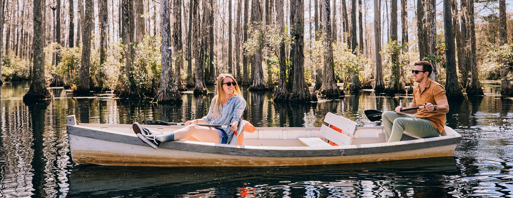 couple in row boat on water